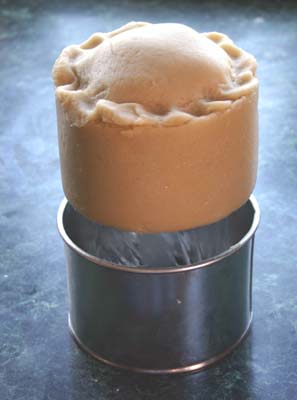 Pie released from tin